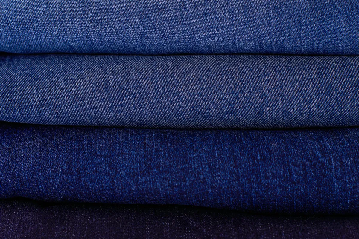 Neatly folded organic cotton children&rsquo;s clothing in bright colors
